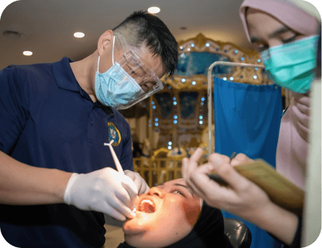 Dentist performing dental procedure